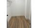 An empty walk-in closet with modern flooring and white walls at 3 Spur Ct, Kissimmee, FL 34743