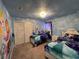 Disney themed bedroom with light blue walls, themed mural and furnishings at 3012 Mahalo Dr, Davenport, FL 33897