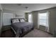 Bright bedroom featuring neutral walls, carpet flooring and large windows providing natural light at 3012 Mahalo Dr, Davenport, FL 33897