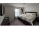 Carpeted bedroom with picture window, overhead light, and modern furnishings at 3012 Mahalo Dr, Davenport, FL 33897