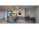 Dining room featuring modern lighting, wall trim and ample seating for entertaining at 3012 Mahalo Dr, Davenport, FL 33897