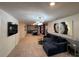 A finished game room with comfortable seating, unique lighting and decor at 3012 Mahalo Dr, Davenport, FL 33897