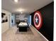 Spacious game room featuring air hockey and themed walls for entertainment at 3012 Mahalo Dr, Davenport, FL 33897