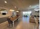 Bright open-concept living area with access to the pool, dining and living room at 3012 Mahalo Dr, Davenport, FL 33897