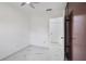 White-walled bedroom features a closet, modern ceiling fan, and marble-look flooring at 306 Modest St, Lakeland, FL 33805