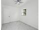 Bright bedroom with marble floors, ceiling fan, and natural light from a window at 306 Modest St, Lakeland, FL 33805