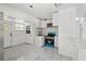 Updated kitchen featuring white cabinets, stainless steel appliances, and stylish tile flooring at 306 Modest St, Lakeland, FL 33805