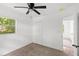 Bedroom featuring a ceiling fan and closet, with an access door to another room at 3115 Avenue U Nw, Winter Haven, FL 33881