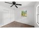 Bedroom with ceiling fan, closet, and window view of the yard at 3115 Avenue U Nw, Winter Haven, FL 33881