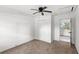 Bedroom with carpet, ceiling fan, and closet is a great spot to relax at 3115 Avenue U Nw, Winter Haven, FL 33881