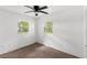 Bright bedroom with a ceiling fan and natural light from two windows at 3115 Avenue U Nw, Winter Haven, FL 33881