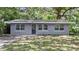 Charming single-story home with a gray exterior and well-maintained front yard at 3115 Avenue U Nw, Winter Haven, FL 33881