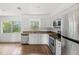 Modern kitchen features stainless steel appliances, granite countertops and bright lighting at 3115 Avenue U Nw, Winter Haven, FL 33881