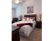 Well-lit bedroom features a queen-sized bed and matching nightstands at 3328 Davis Ter, The Villages, FL 32163