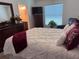 Bedroom features queen bed, dark wood furniture, and adjacent bathroom at 3328 Davis Ter, The Villages, FL 32163
