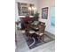 Dining room features a wooden table, decorative wall art and matching hutch at 3328 Davis Ter, The Villages, FL 32163