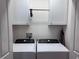 Bright laundry room features new white washer and dryer at 3328 Davis Ter, The Villages, FL 32163