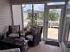 Cozy screened-in porch features comfortable seating and an outdoor view at 3328 Davis Ter, The Villages, FL 32163