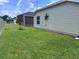 Well-maintained side yard with lush green grass and meticulous landscaping at 3328 Davis Ter, The Villages, FL 32163