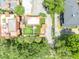 Aerial view of a property featuring landscaped rooftop terraces surrounded by mature trees and lush greenery at 337 Cathcart Ave # 6, Orlando, FL 32803