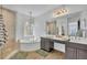 Elegant bathroom featuring a soaking tub, a separate glass shower, double sinks, and modern fixtures at 337 Cathcart Ave # 6, Orlando, FL 32803