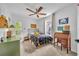 Bright bedroom features a ceiling fan, neutral carpet, and natural light from the sliding glass door at 337 Cathcart Ave # 6, Orlando, FL 32803