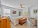 Serene bedroom features a ceiling fan, neutral tones, and French doors leading to the outside at 337 Cathcart Ave # 6, Orlando, FL 32803