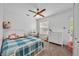 Bright bedroom featuring a built-in desk, dresser, and a cozy seating area at 337 Cathcart Ave # 6, Orlando, FL 32803