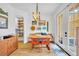 Bright dining area features a cozy banquette, red chairs, and stylish accents at 337 Cathcart Ave # 6, Orlando, FL 32803