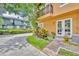 Inviting home exterior with a well-manicured lawn, walkway, and beautiful trees enhancing curb appeal at 337 Cathcart Ave # 6, Orlando, FL 32803