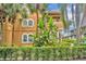 Stunning close-up of a stucco home showcasing tropical landscaping and architectural charm at 337 Cathcart Ave # 6, Orlando, FL 32803
