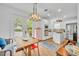 Bright kitchen adjacent to the dining area with white cabinets and lots of natural light at 337 Cathcart Ave # 6, Orlando, FL 32803