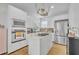 Modern kitchen featuring white cabinetry, stainless steel appliances, and a functional island at 337 Cathcart Ave # 6, Orlando, FL 32803