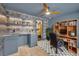 Office features a desk, wood bookcase, grey wallpaper, built-in shelves, and an en suite bathroom at 337 Cathcart Ave # 6, Orlando, FL 32803