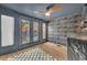 Office features grey walls with patterned wallpaper, wood floors, and a set of french doors at 337 Cathcart Ave # 6, Orlando, FL 32803