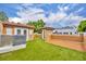 Rooftop patio with synthetic grass, orange stucco walls, and a composite deck at 337 Cathcart Ave # 6, Orlando, FL 32803