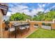 Elegant rooftop patio with sleek dining set, artificial turf, and planter boxes for a modern outdoor retreat at 337 Cathcart Ave # 6, Orlando, FL 32803