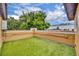 Rooftop patio featuring synthetic grass, string lights, and an orange stucco wall at 337 Cathcart Ave # 6, Orlando, FL 32803
