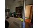 Bedroom featuring a four-poster bed, built-in shelving and ample storage space at 3810 Se 22Nd Pl, Ocala, FL 34471