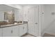 Well-appointed bathroom with double vanity, a shower, and ample storage space at 4185 Paragraph Dr, Kissimmee, FL 34746