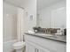 Cozy bathroom featuring a shower-tub combo with white tile at 4185 Paragraph Dr, Kissimmee, FL 34746