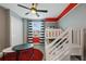 Inviting bedroom with bunk beds, window view, and a cozy atmosphere at 4185 Paragraph Dr, Kissimmee, FL 34746