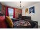 Well-lit bedroom featuring themed decor, brick accent walls, and comfortable bedding at 4185 Paragraph Dr, Kissimmee, FL 34746