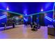 Entertainment room featuring a TV, game tables, and neon lighting for a fun experience at 4185 Paragraph Dr, Kissimmee, FL 34746