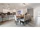 Open kitchen and dining area with modern appliances, a center island, and seating for several people at 4185 Paragraph Dr, Kissimmee, FL 34746