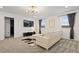Living room featuring a white sectional sofa, black media console, and modern light fixture at 4185 Paragraph Dr, Kissimmee, FL 34746
