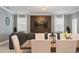 Living room featuring a wall of decorative wood and TV, neutral paint and furnishings at 4185 Paragraph Dr, Kissimmee, FL 34746