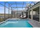 Enclosed pool and spa with lounge chairs for relaxing and enjoying the Florida sun at 4185 Paragraph Dr, Kissimmee, FL 34746