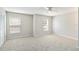 Spacious bedroom with neutral walls, carpeted floors, two windows and closet at 4447 Brook Hollow Cir, Winter Springs, FL 32708