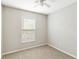 Bedroom featuring neutral walls, carpeted floors, and a single window providing natural light at 4447 Brook Hollow Cir, Winter Springs, FL 32708